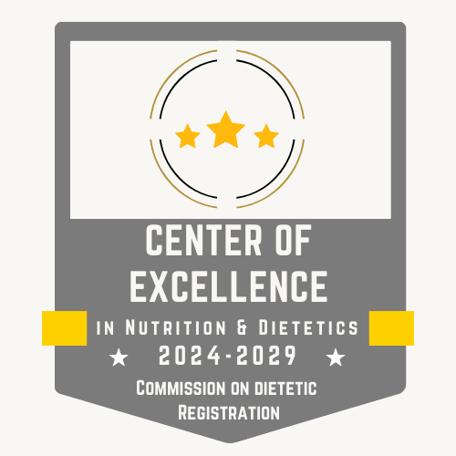 Badge design for the Center of Excellence in Nutrition & Dietetics 2024-2029. The badge features a gray shield with three gold stars in a circular design at the top. Below, the text “Center of Excellence in Nutrition & Dietetics 2024-2029” is displayed in bold white letters, with “Commission on Dietetic Registration” at the bottom